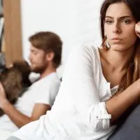 Dissapointed beautiful brunette girl in quarrel with her boyfriend background.