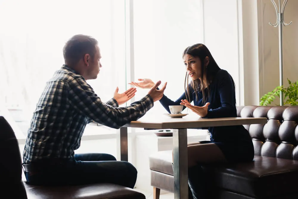 couple arguing in restaurant