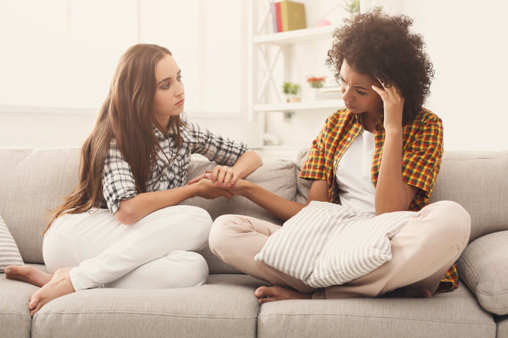 Two women talking about problems at home