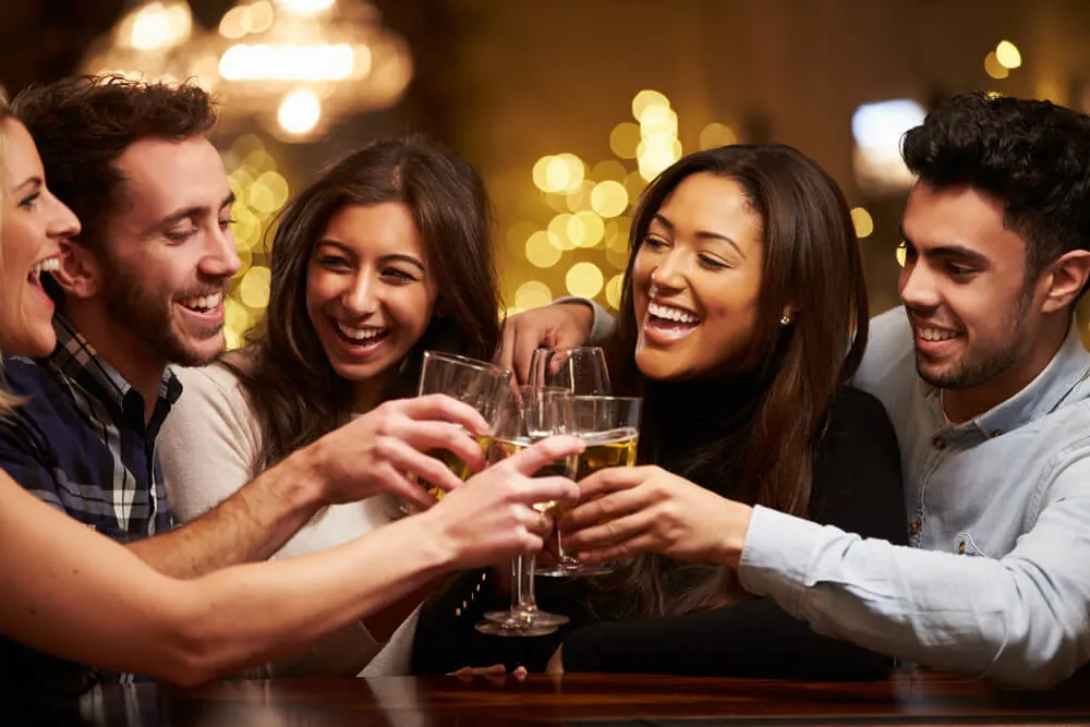 I Hate Drinking Alcohol, But Why I Cannot Stop? 1 Group of friends enjoying evening drinks in bar