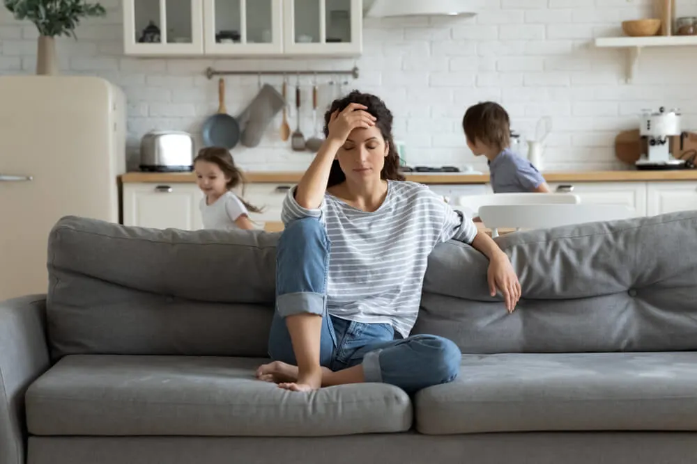 Am I Too Lazy to be a Parent? 1 Young tired single mother suffers from headache