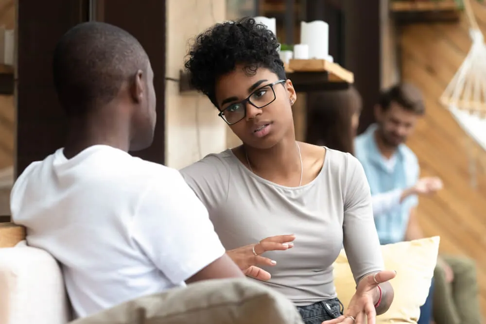 woman talking with man in cafe