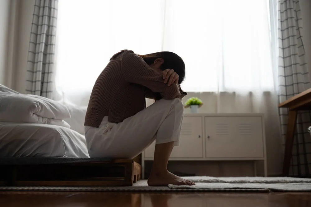 Close up young woman feeling upset, sad, unhappy or disappoint crying lonely in her room