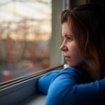 Lonely girl thinking about embarrassing moment