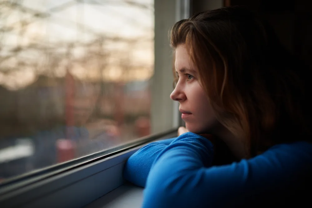 Lonely girl thinking about embarrassing moment