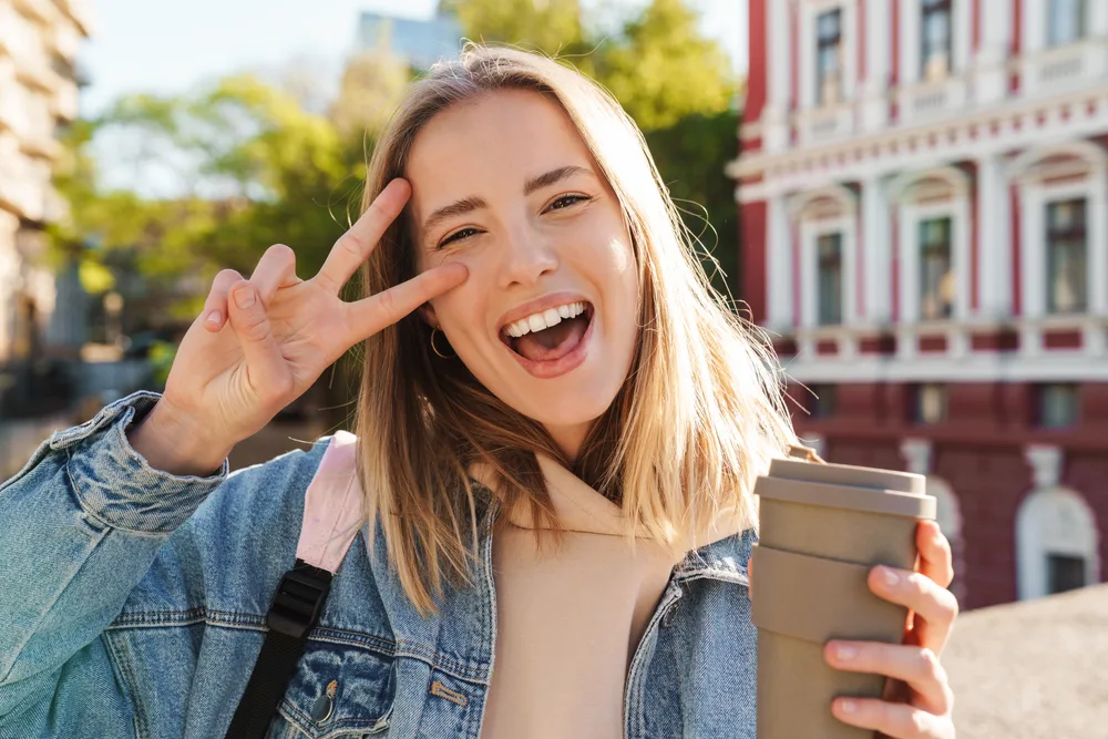 Happy girl alone walking in the city