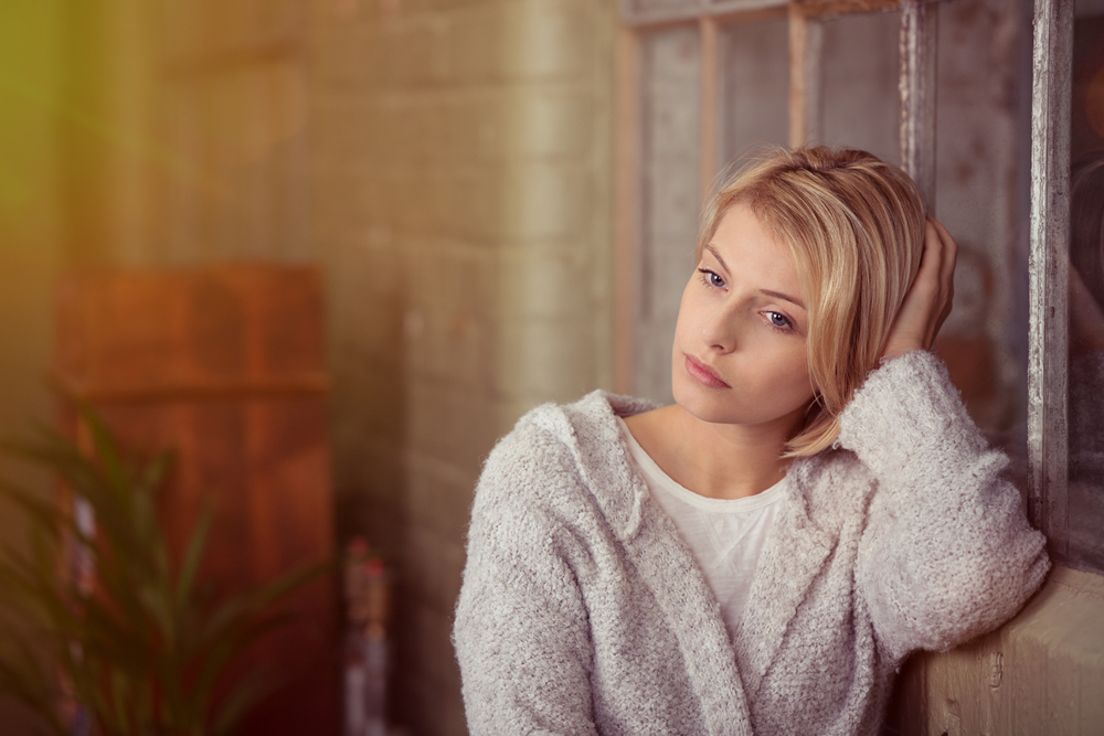 Pensive thoughtful young girl feeling lonely looking away lost in thoughts