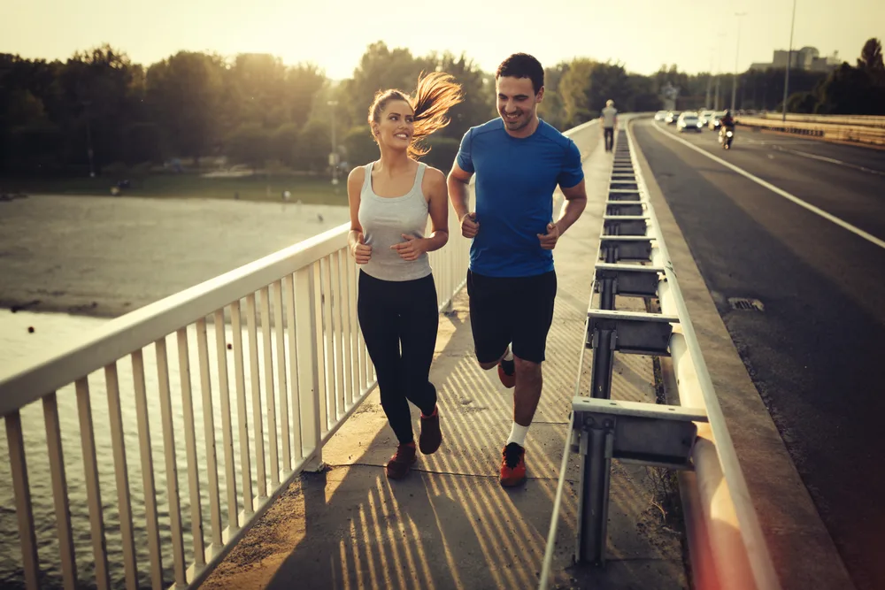 Athletic couple jogging together