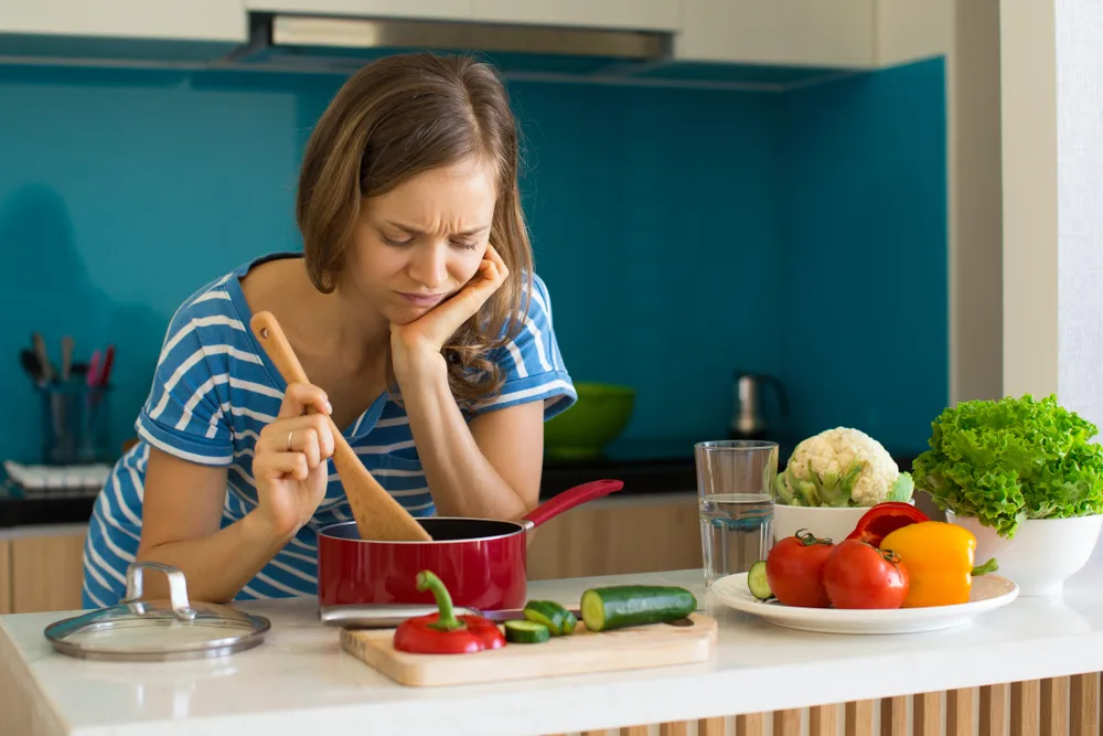 Dissatisfied Woman Cooking