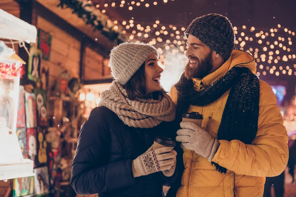 Couple having fun together at a christmas fairy