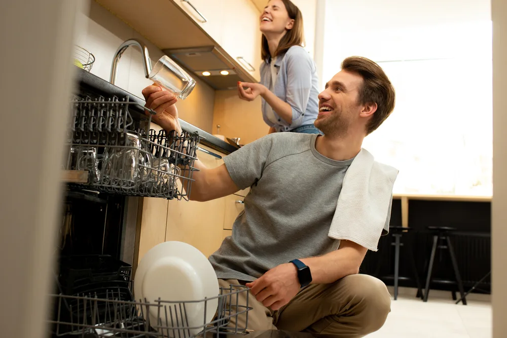 Husband and wife share household chores
